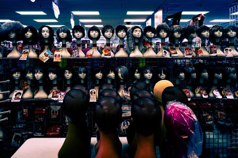 Two rows of wigs facing each other